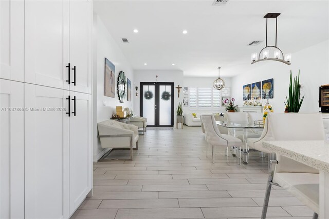 8236 SW 36th St, Miami, FL 33155 - dining space featuring a chandelier, recessed lighting, french doors, and light wood-style floors