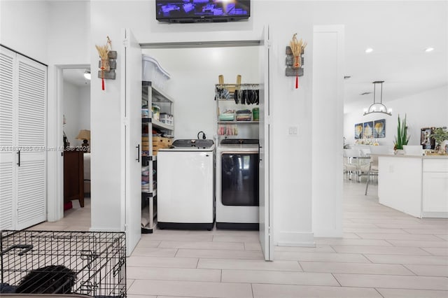 8236 SW 36th St, Miami, FL 33155 - kitchen with washer and clothes dryer, recessed lighting, and white cabinets