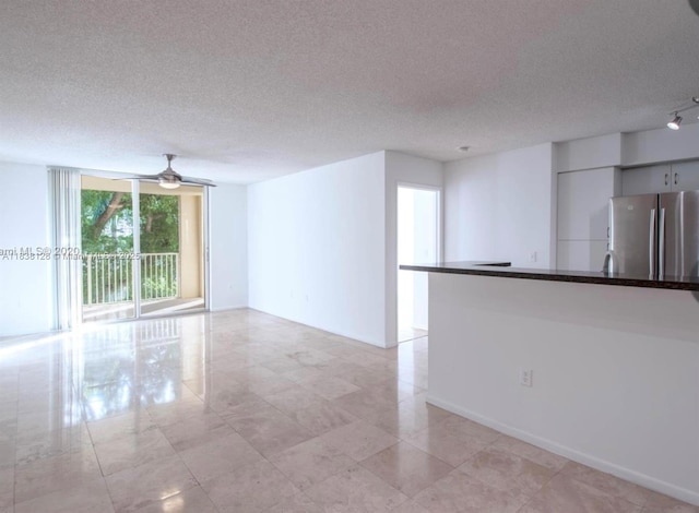 19501 E Country Club Dr Unit 9306, Aventura, FL 33180 - empty room featuring a textured ceiling and a ceiling fan