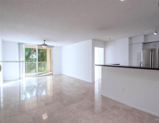 19501 E Country Club Dr Unit 9306, Aventura, FL 33180 - empty room featuring a textured ceiling and ceiling fan