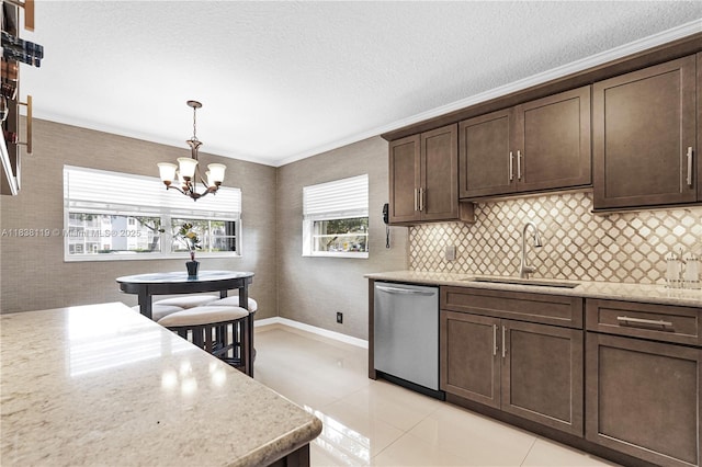 12650 SW 6th St Unit 101K, Pembroke Pines, FL 33027 - kitchen with stainless steel dishwasher, dark brown cabinetry, a chandelier, crown molding, and hanging light fixtures