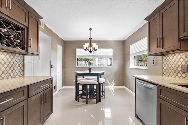 12650 SW 6th St Unit 101K, Pembroke Pines, FL 33027 - kitchen with stainless steel dishwasher, a chandelier, healthy amount of natural light, dark brown cabinetry, and crown molding