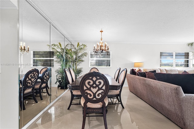 12650 SW 6th St Unit 101K, Pembroke Pines, FL 33027 - dining room with a chandelier, a textured ceiling, and ornamental molding