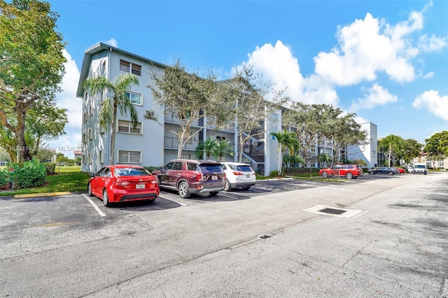 12650 SW 6th St Unit 101K, Pembroke Pines, FL 33027 - view of property with uncovered parking