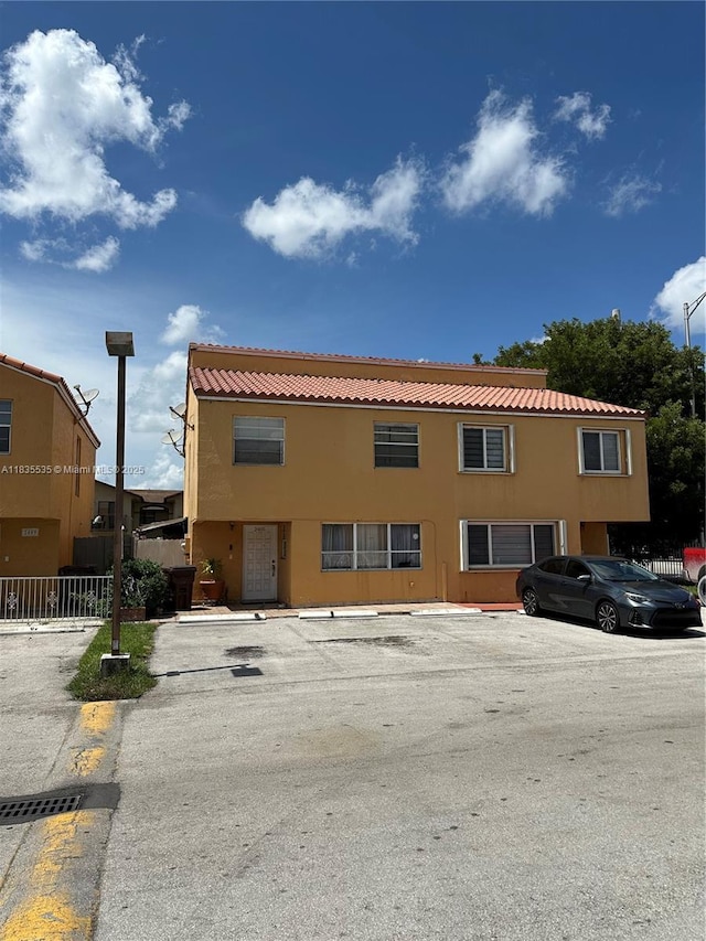2405 W 54th Pl Unit 03, Hialeah, FL 33016 - view of building exterior featuring uncovered parking