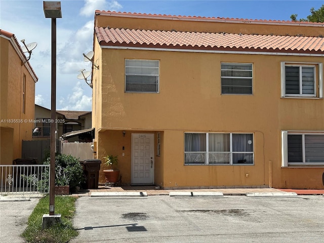 2405 W 54th Pl Unit 03, Hialeah, FL 33016 - view of property featuring uncovered parking and stucco siding