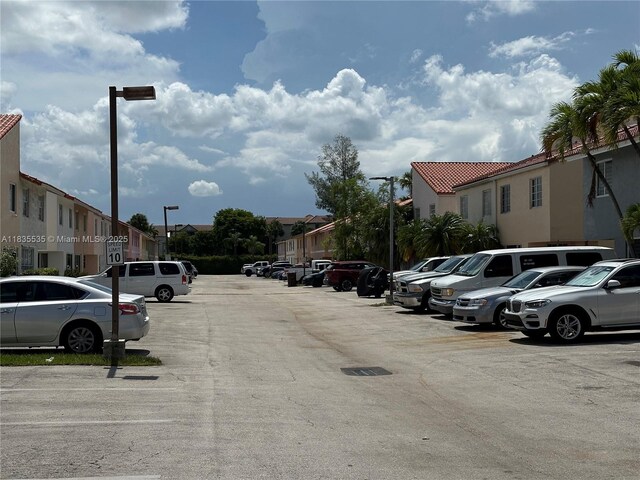 2405 W 54th Pl Unit 03, Hialeah, FL 33016 - uncovered parking lot with a residential view