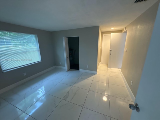 2307 Rodman St, Hollywood, FL 33020 - spare room with baseboards and light marble finish flooring