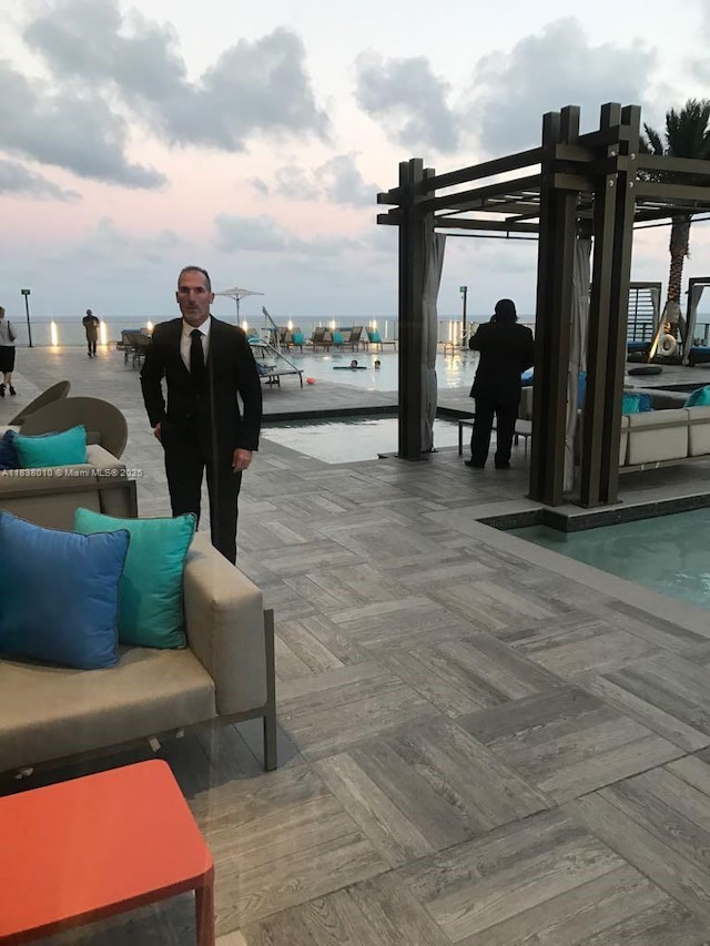 4111 S Ocean Dr Unit 3105, Hollywood, FL 33019 - surrounding community featuring a swimming pool, a pergola, and a water view