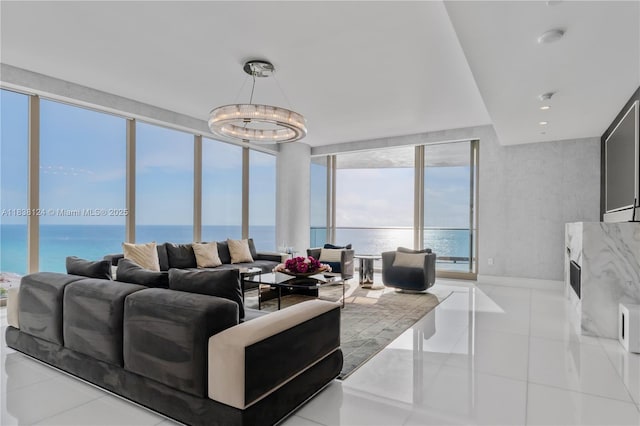 17975 Collins Ave Unit 1202, Sunny Isles Beach, FL 33160 - living area featuring a water view, a chandelier, and light tile patterned floors