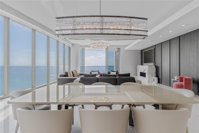 17975 Collins Ave Unit 1202, Sunny Isles Beach, FL 33160 - dining room with a chandelier and a water view