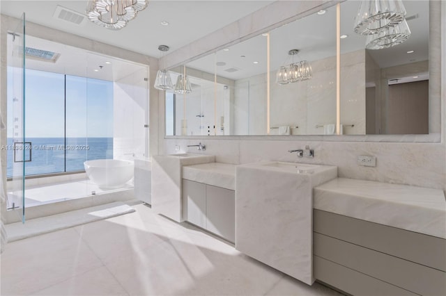 17975 Collins Ave Unit 1202, Sunny Isles Beach, FL 33160 - full bath with a chandelier, a freestanding tub, double vanity, a shower stall, and tile patterned flooring