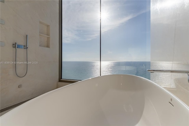 17975 Collins Ave Unit 1202, Sunny Isles Beach, FL 33160 - bathroom featuring a freestanding bath and a water view