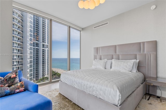 17975 Collins Ave Unit 1202, Sunny Isles Beach, FL 33160 - bedroom with a water view and a wall of windows