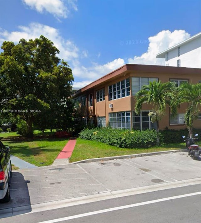 1040 94th St, Bay Harbor Islands, FL 33154 - view of building exterior featuring uncovered parking