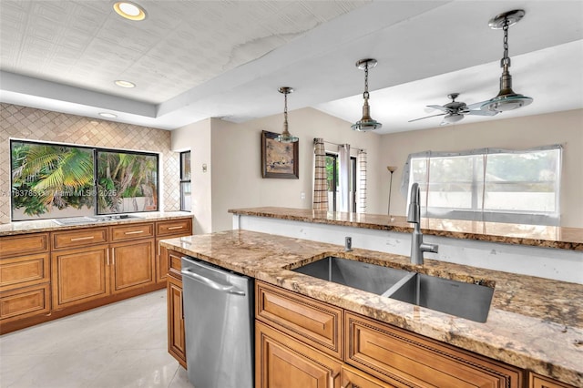 911 Mockingbird Ln, Plantation, FL 33324 - kitchen featuring dishwasher, brown cabinetry, decorative light fixtures, light stone countertops, and recessed lighting
