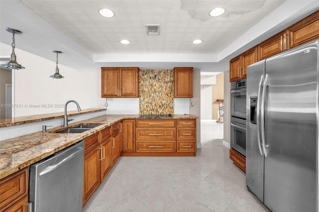 911 Mockingbird Ln, Plantation, FL 33324 - kitchen featuring stainless steel appliances, brown cabinets, light stone counters, a tray ceiling, and recessed lighting