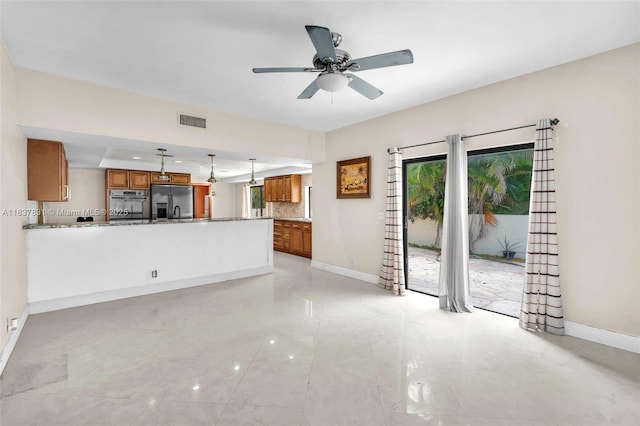 911 Mockingbird Ln, Plantation, FL 33324 - unfurnished living room featuring plenty of natural light, ceiling fan, and light tile patterned floors