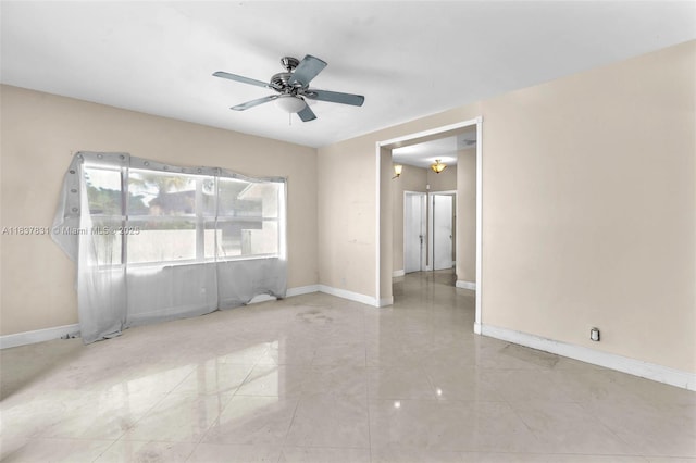 911 Mockingbird Ln, Plantation, FL 33324 - spare room featuring baseboards and ceiling fan