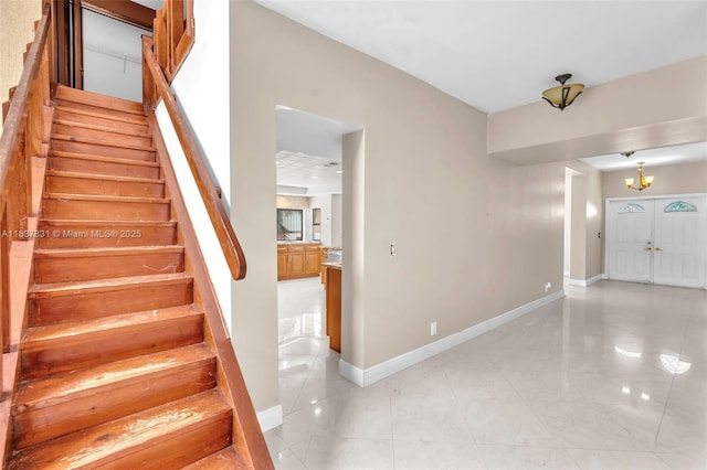 911 Mockingbird Ln, Plantation, FL 33324 - stairway with a chandelier and tile patterned flooring