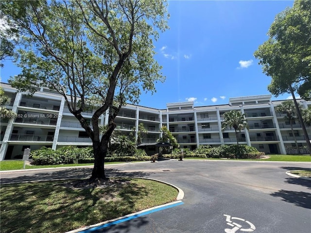 16171 Blatt Blvd Unit 104, Weston, FL 33326 - view of apartment building / complex featuring uncovered parking