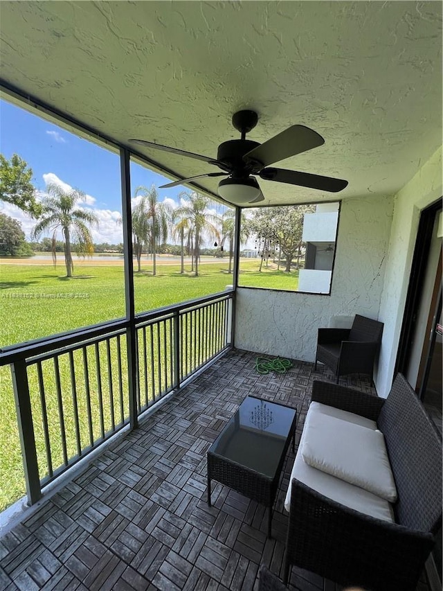 16171 Blatt Blvd Unit 104, Weston, FL 33326 - sunroom / solarium with ceiling fan and plenty of natural light