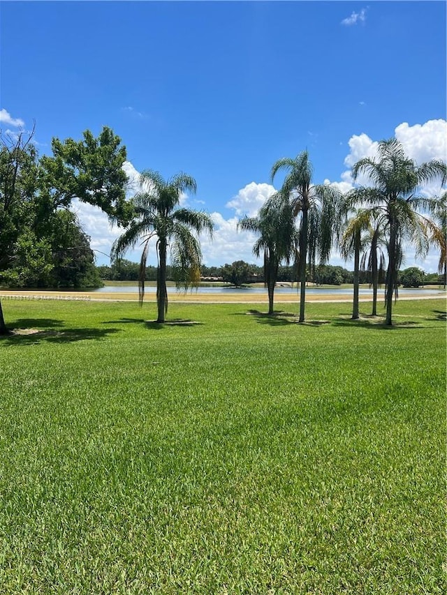 16171 Blatt Blvd Unit 104, Weston, FL 33326 - surrounding community with a yard and a water view