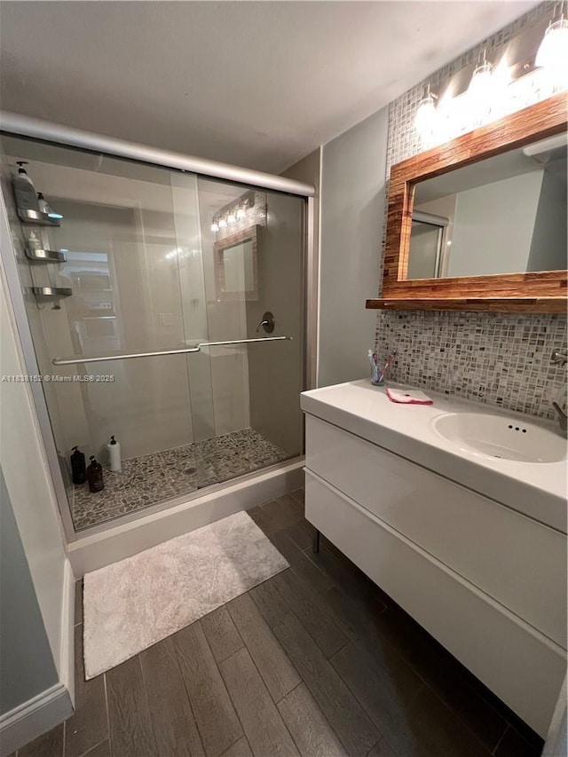 16171 Blatt Blvd Unit 104, Weston, FL 33326 - full bath with wood finished floors, a stall shower, vanity, and tasteful backsplash