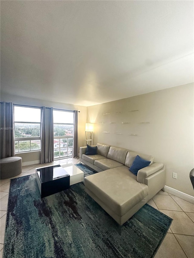 2351 Douglas Rd Unit 702, Miami, FL 33145 - living room featuring tile patterned floors and baseboards