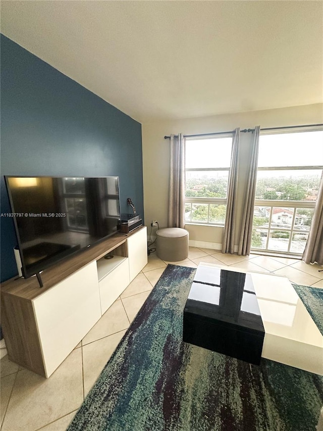2351 Douglas Rd Unit 702, Miami, FL 33145 - living room with light tile patterned floors and vaulted ceiling