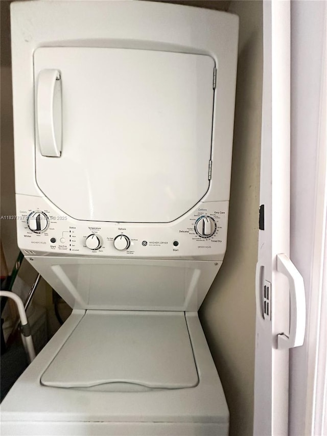 2351 Douglas Rd Unit 702, Miami, FL 33145 - washroom with stacked washer and clothes dryer