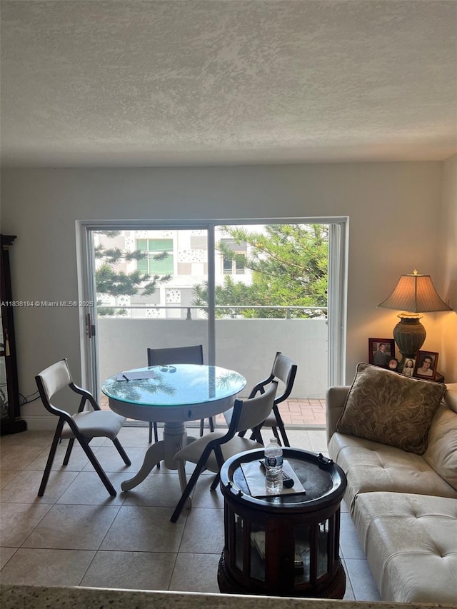 1200 14th St Unit 3C, Miami Beach, FL 33139 - dining space with a textured ceiling and tile patterned floors
