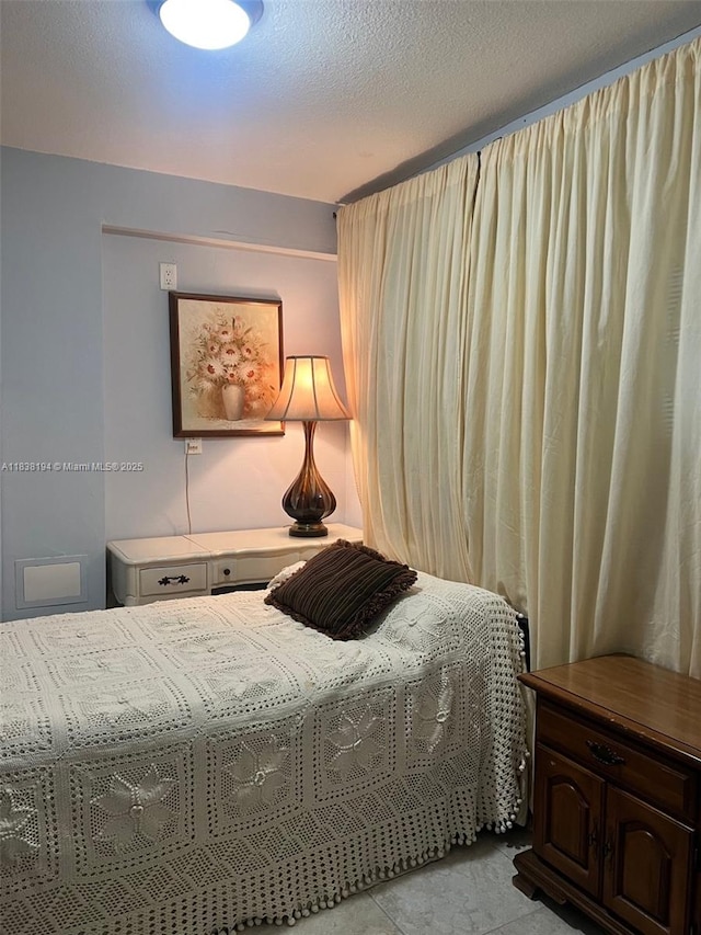 1200 14th St Unit 3C, Miami Beach, FL 33139 - bedroom with a textured ceiling