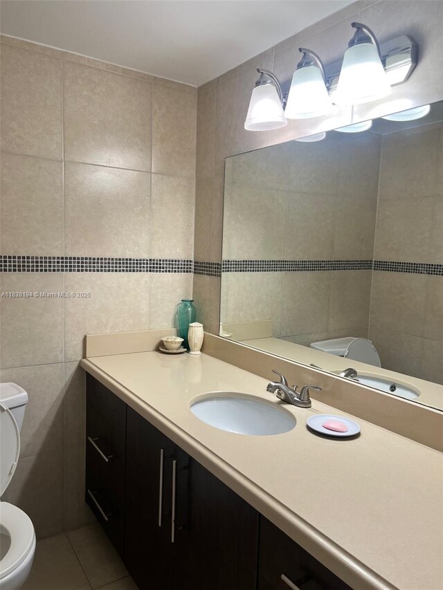 1200 14th St Unit 3C, Miami Beach, FL 33139 - half bathroom featuring tile walls, vanity, and tile patterned flooring