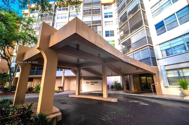 1300 Saint Charles Pl Unit 613, Pembroke Pines, FL 33026 - view of property with covered parking