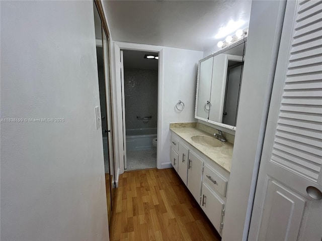 1300 Saint Charles Pl Unit 613, Pembroke Pines, FL 33026 - bathroom featuring vanity, wood finished floors, and a bath