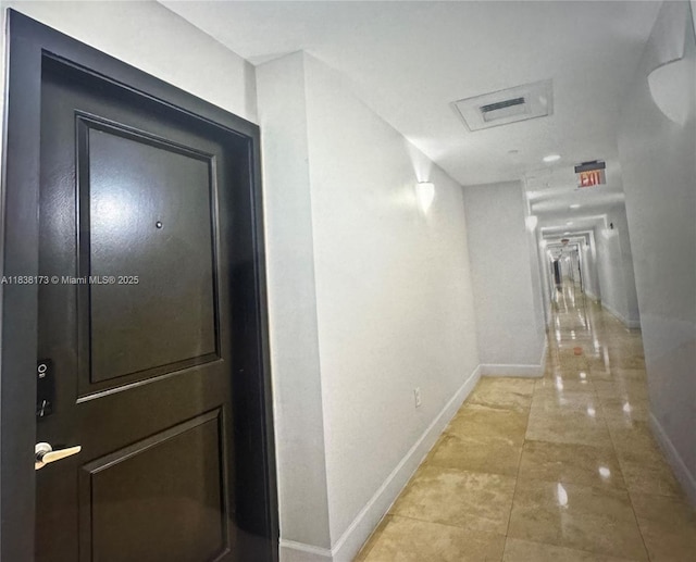 10 Aragon Ave Unit 1118, Coral Gables, FL 33134 - corridor featuring baseboards and attic access