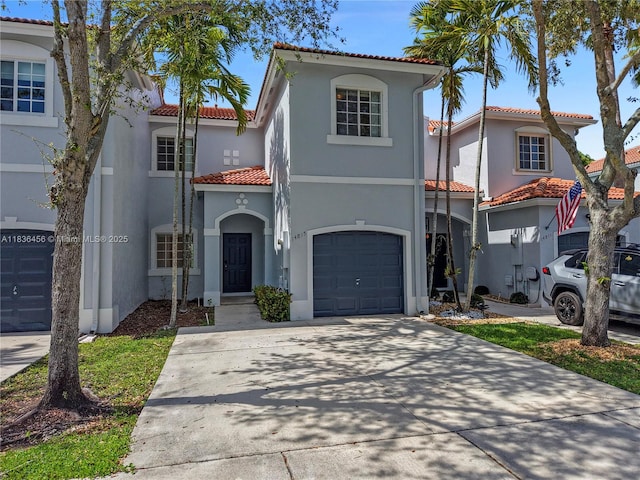 14815 SW 9th Ln, Miami, FL 33194 - mediterranean / spanish home featuring a tiled roof, stucco siding, driveway, and a garage