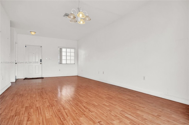 14815 SW 9th Ln, Miami, FL 33194 - spare room featuring a chandelier and light wood-style floors