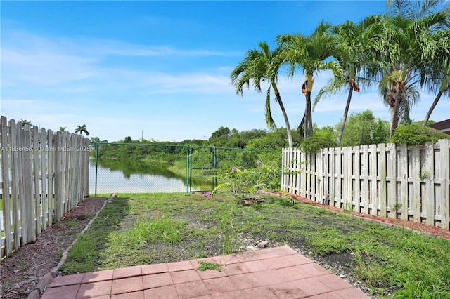 14815 SW 9th Ln, Miami, FL 33194 - fenced backyard featuring a water view and a gate