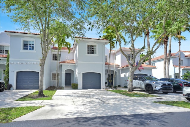 14815 SW 9th Ln, Miami, FL 33194 - mediterranean / spanish-style house with a tiled roof, stucco siding, driveway, and an attached garage