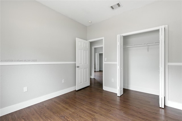 8899 NW 169th Ter, Hialeah, FL 33018 - unfurnished bedroom featuring wood finished floors and a closet