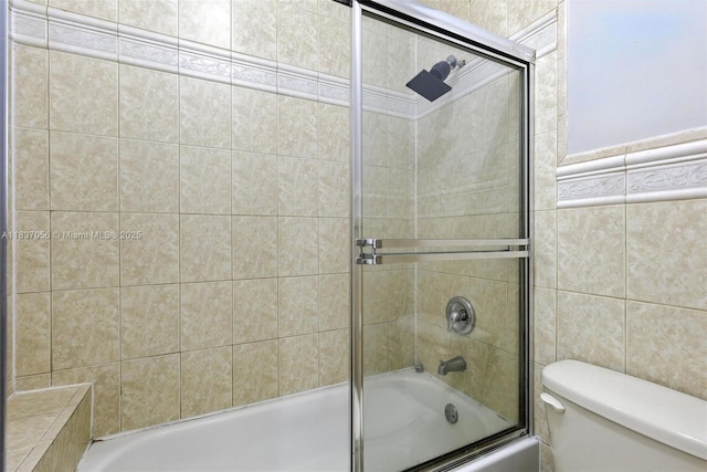 8899 NW 169th Ter, Hialeah, FL 33018 - bathroom featuring enclosed tub / shower combo and tile walls