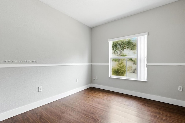 8899 NW 169th Ter, Hialeah, FL 33018 - spare room with baseboards and wood finished floors