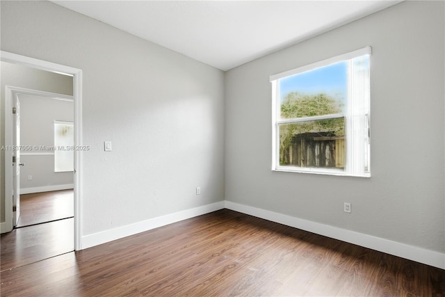 8899 NW 169th Ter, Hialeah, FL 33018 - unfurnished room featuring wood finished floors and baseboards