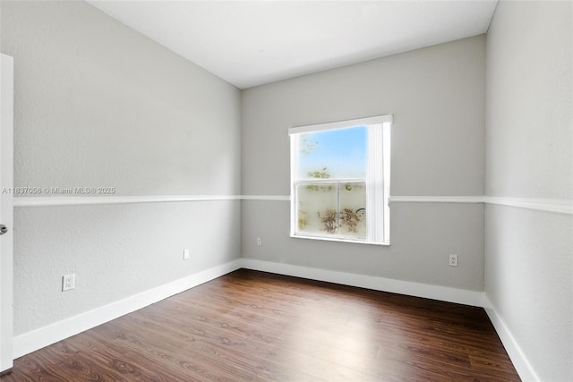 8899 NW 169th Ter, Hialeah, FL 33018 - spare room featuring wood finished floors and baseboards