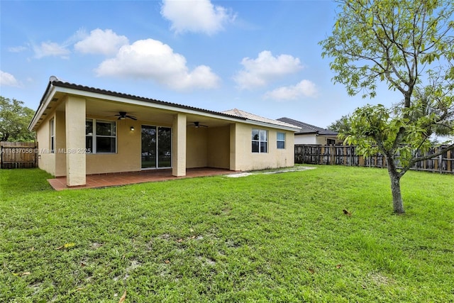 8899 NW 169th Ter, Hialeah, FL 33018 - rear view of house with ceiling fan, stucco siding, a fenced backyard, and a patio area