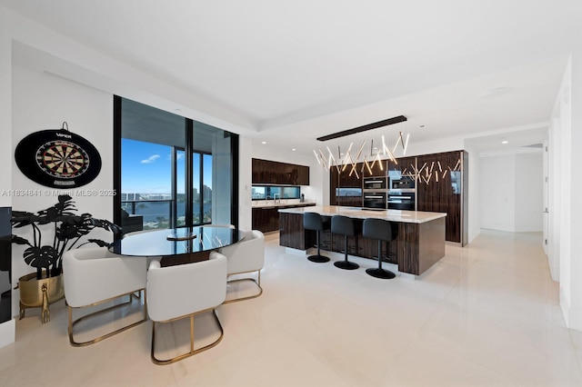 18555 Collins Ave Unit 2003, Sunny Isles Beach, FL 33160 - dining area with recessed lighting, light tile patterned floors, and a wall of windows