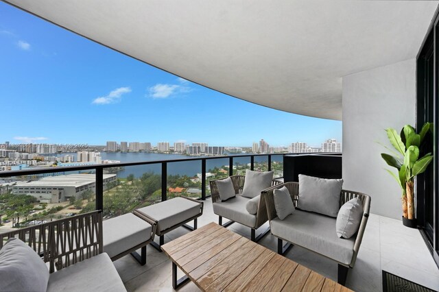 18555 Collins Ave Unit 2003, Sunny Isles Beach, FL 33160 - balcony with a city view, outdoor lounge area, and a water view
