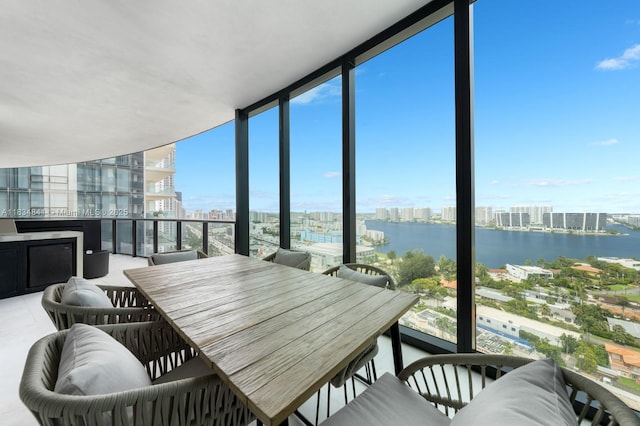 18555 Collins Ave Unit 2003, Sunny Isles Beach, FL 33160 - balcony featuring a city view, a water view, and outdoor dining space